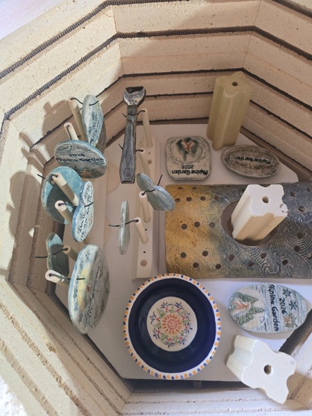 Ceramic pieces arranged in the kiln at Clay Therapy
