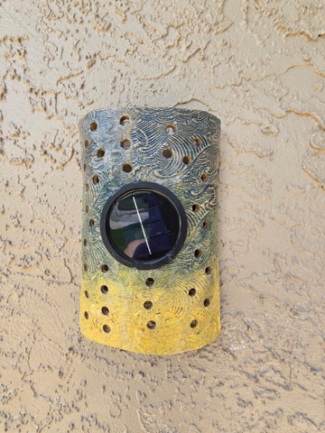 Handmade outdoor solar wall sconce by Clay Therapy